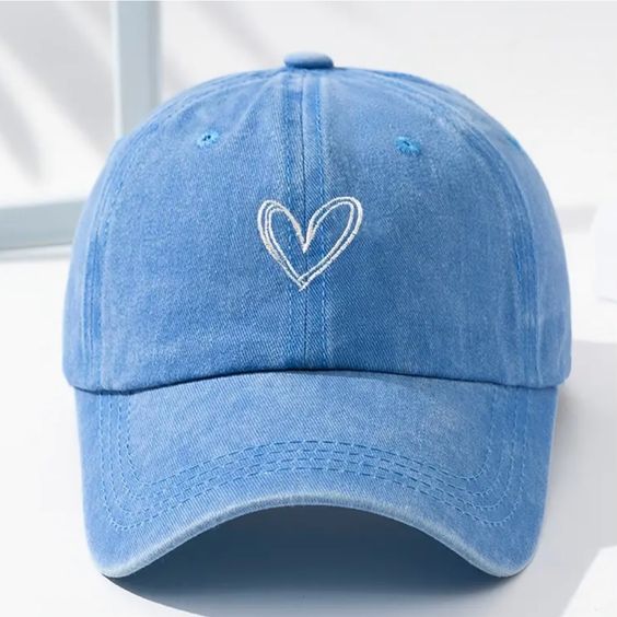 Step up your style game with a Light Blue Fitted Hat: Elevate any outfit with this trendy, head-turning accessory. Shop now!